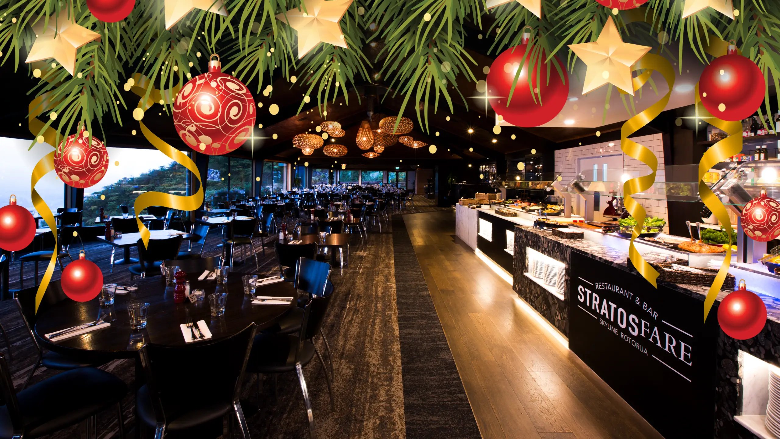 Stratosfare Restaurant & Bar in Rotorua decorated for Christmas, featuring festive ornaments and ribbons above a modern buffet dining area with panoramic views.