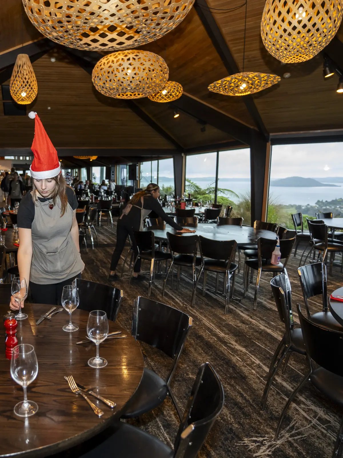 Restaurant being set up for a Christmas function at Skyline Rotorua with lake views