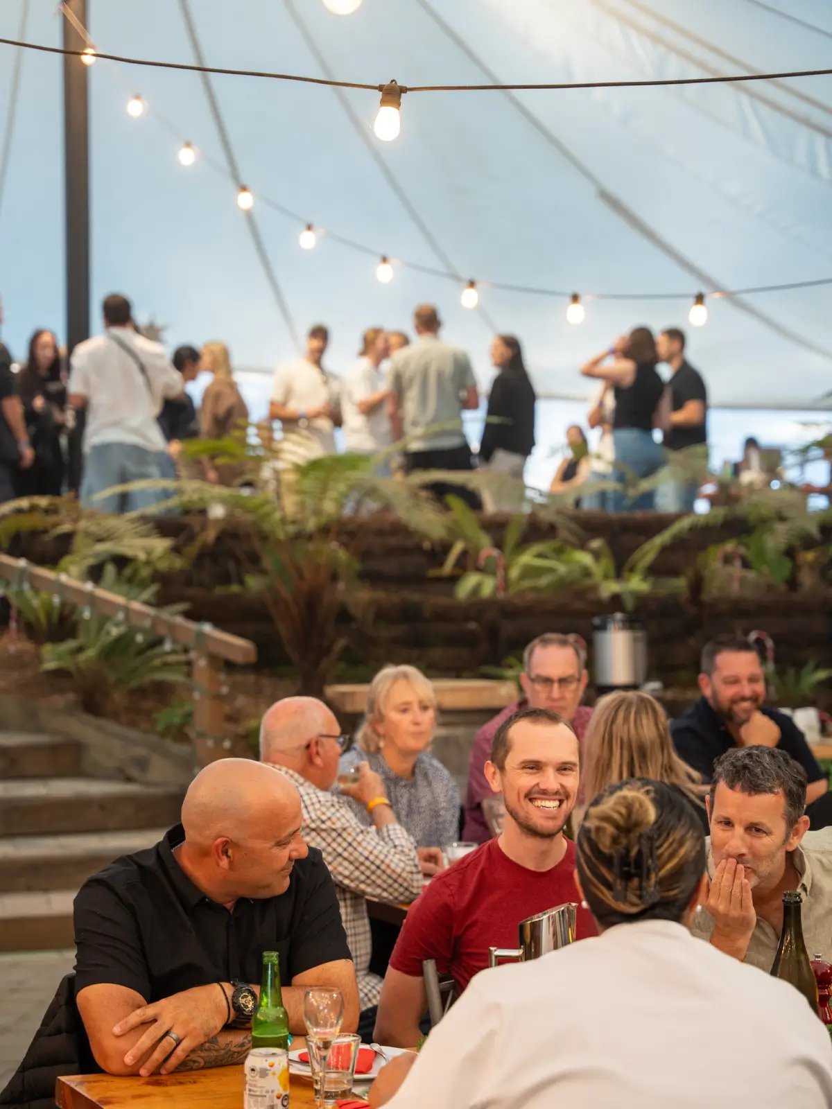 Guests dining at Hidden Forest venue during a Christmas function at Skyline Rotorua
