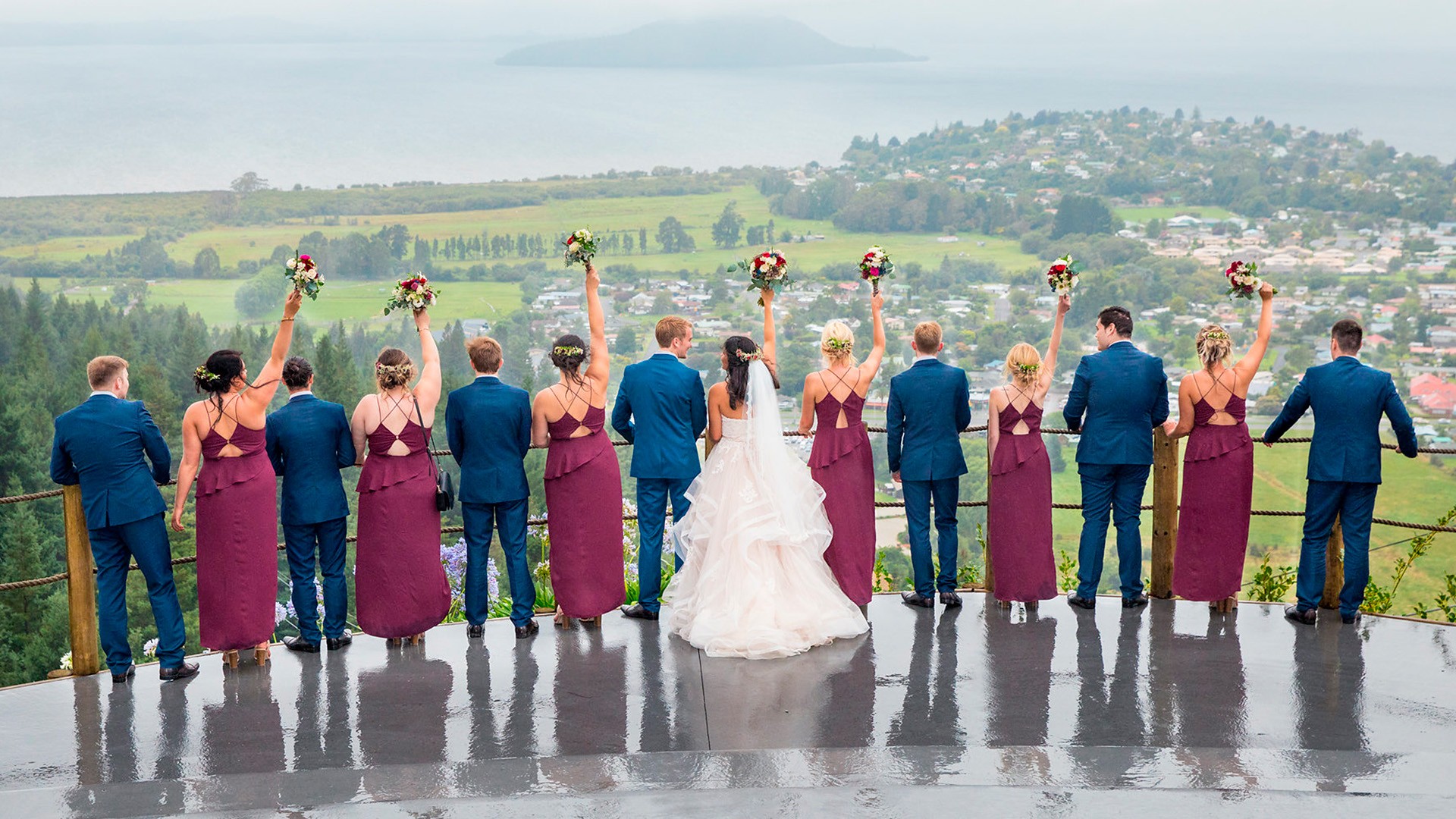 Wedding group overlooking lake view at Skyline Rotorua