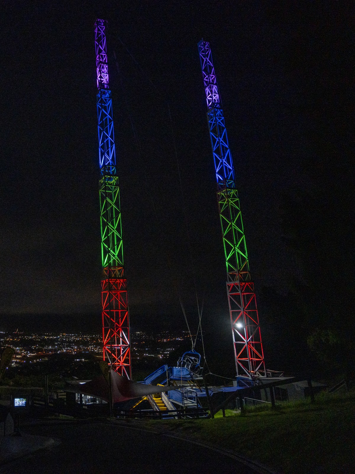 Night view over Rotorua from Skyline with illuminated Sky Swing and city lights