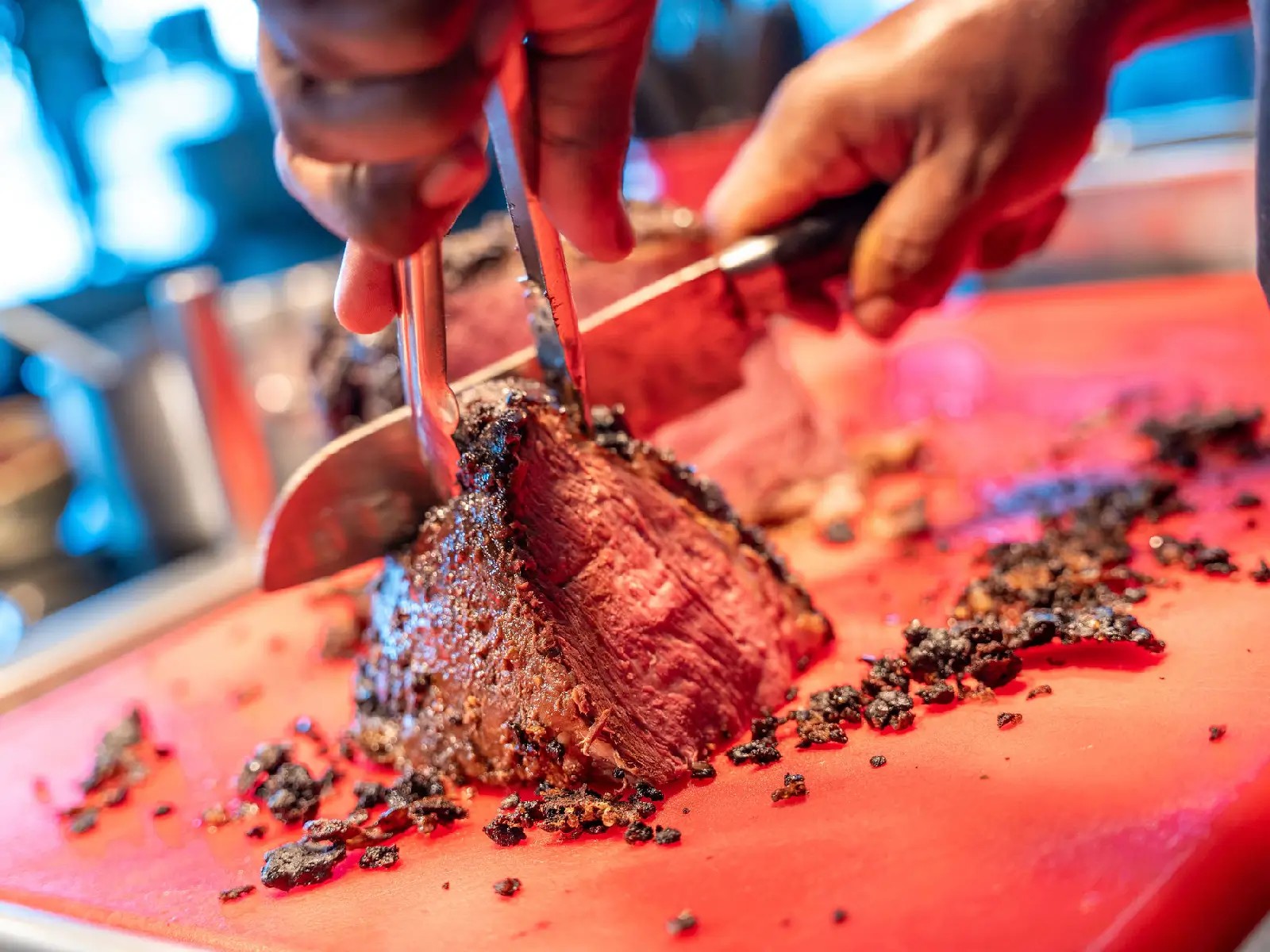 Chef slicing roast beef at a carvery station during a buffet dining experience at Skyline Rotorua