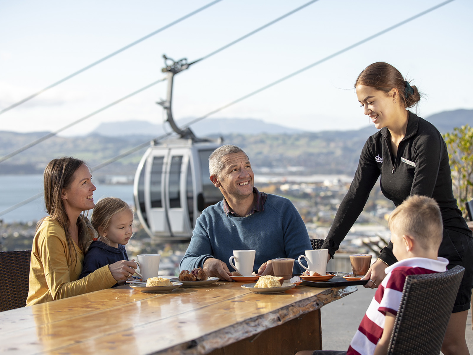 Family eating outside at the Market Kitchen Cafe in Rotorua