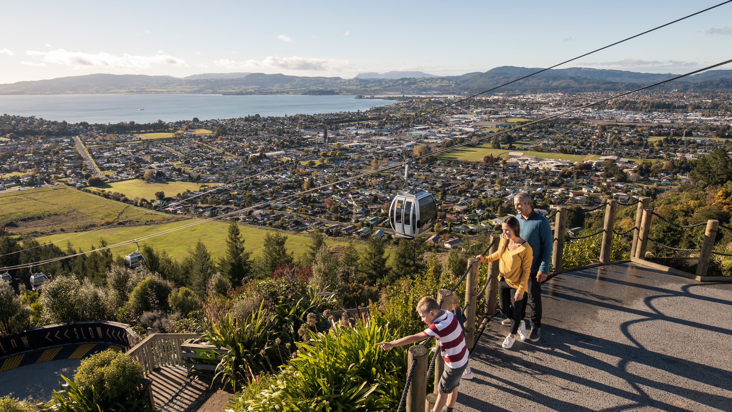 People admiring the view on top of the mountain